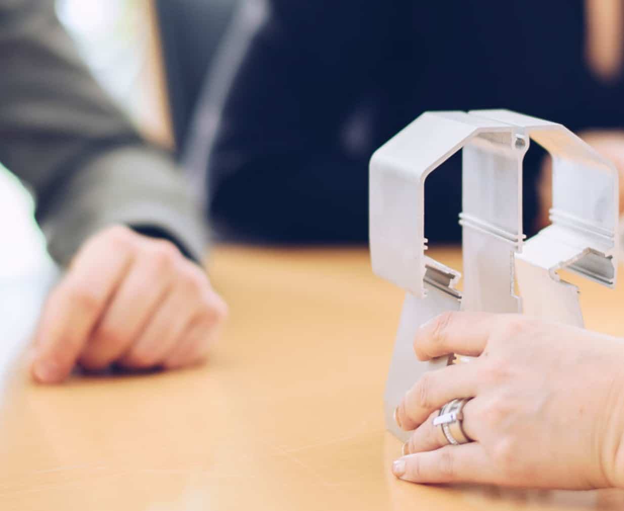 Hand holding a product created by Profilgruppen