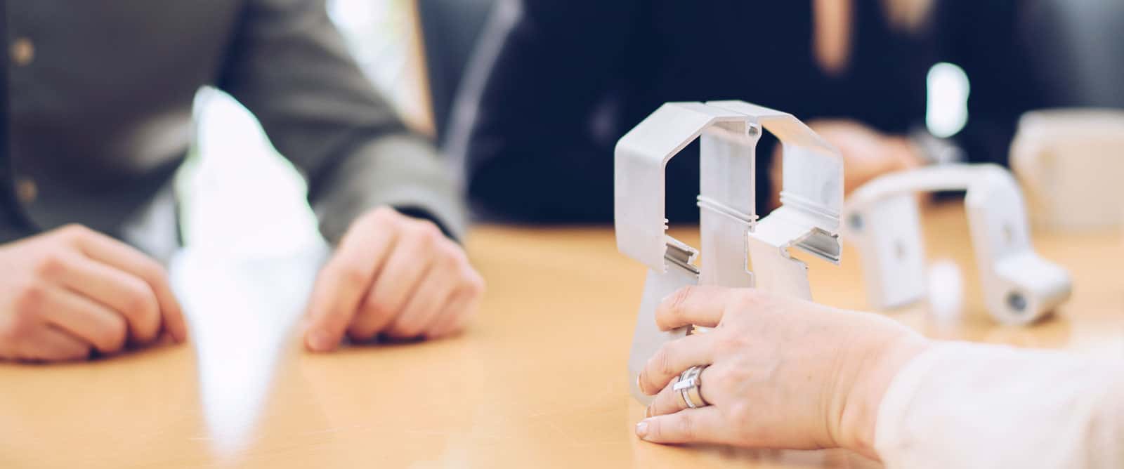 Hand holding a product created by Profilgruppen