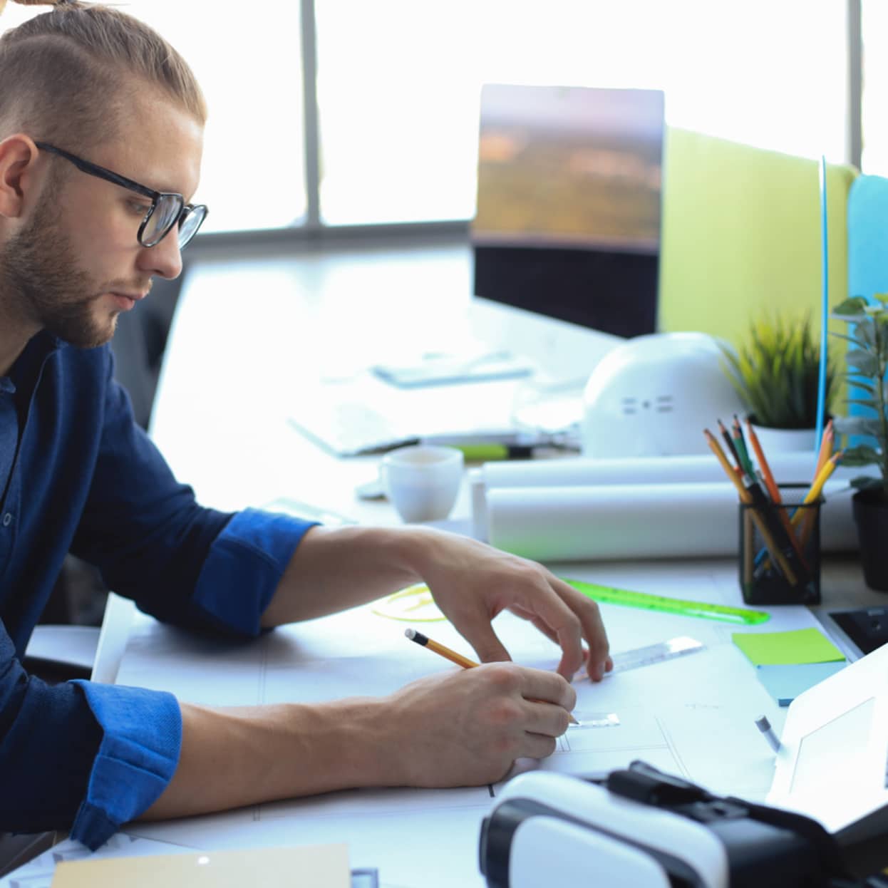 Man sitting at desk thinking about ERP