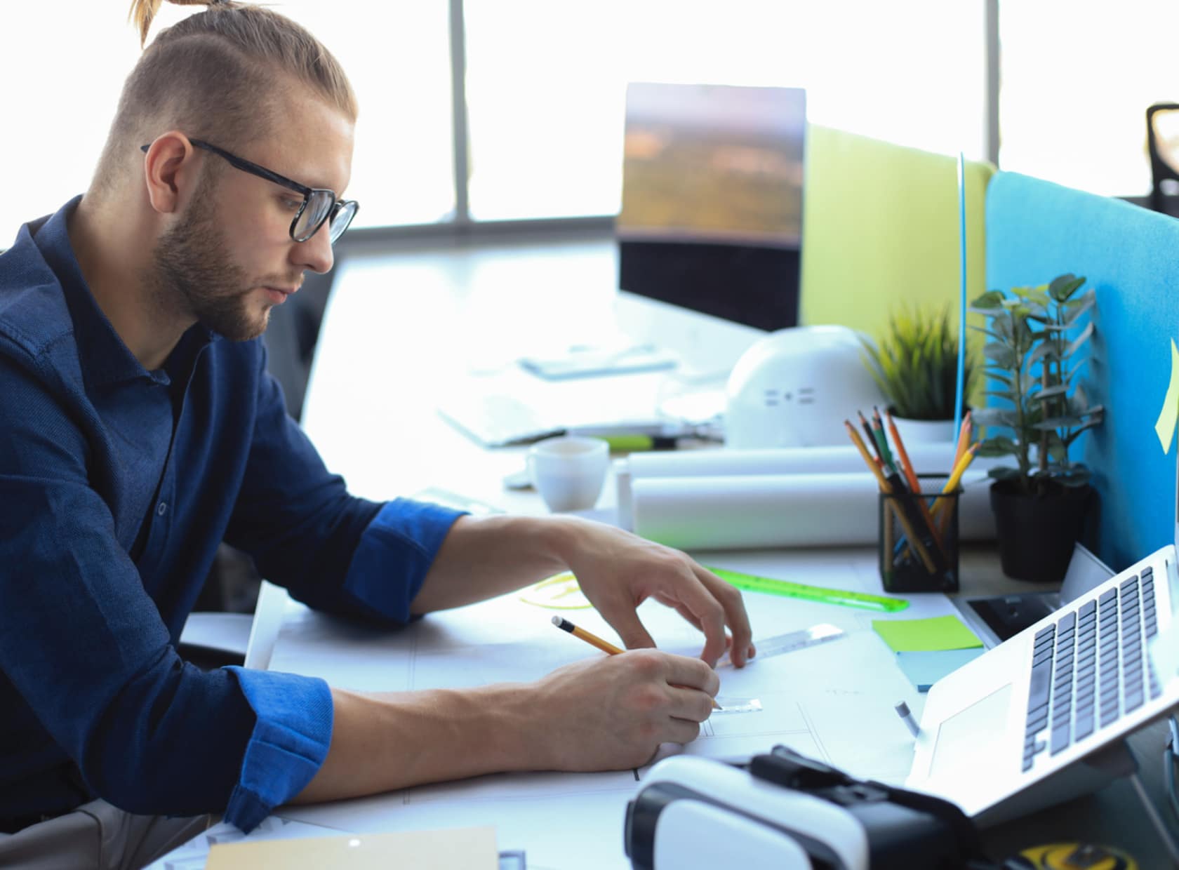 Man sitting at desk thinking about ERP