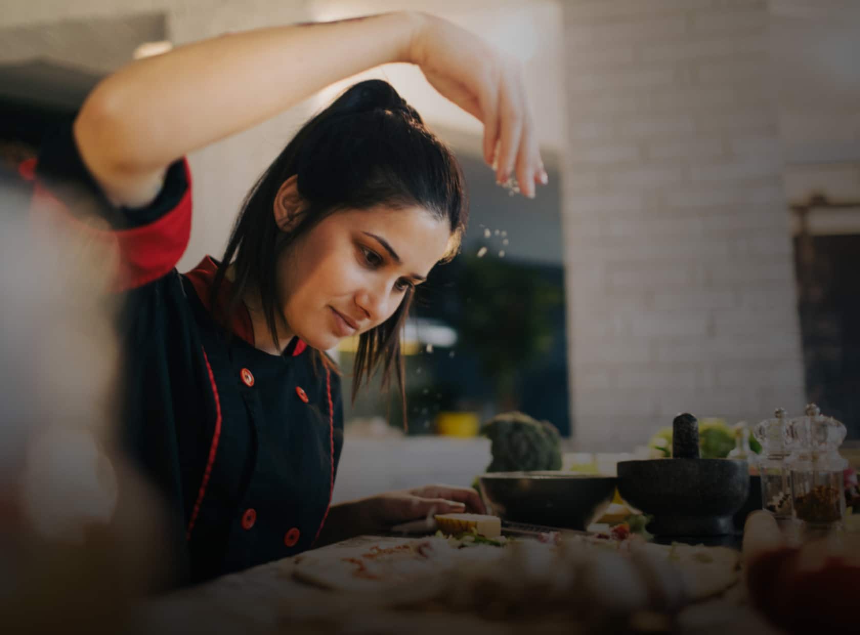 Chef making pizza in a kitchen