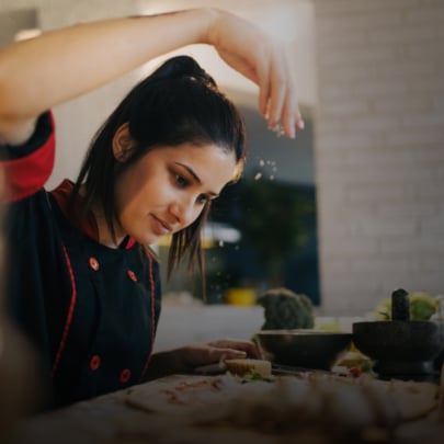 Chef making pizza in a kitchen