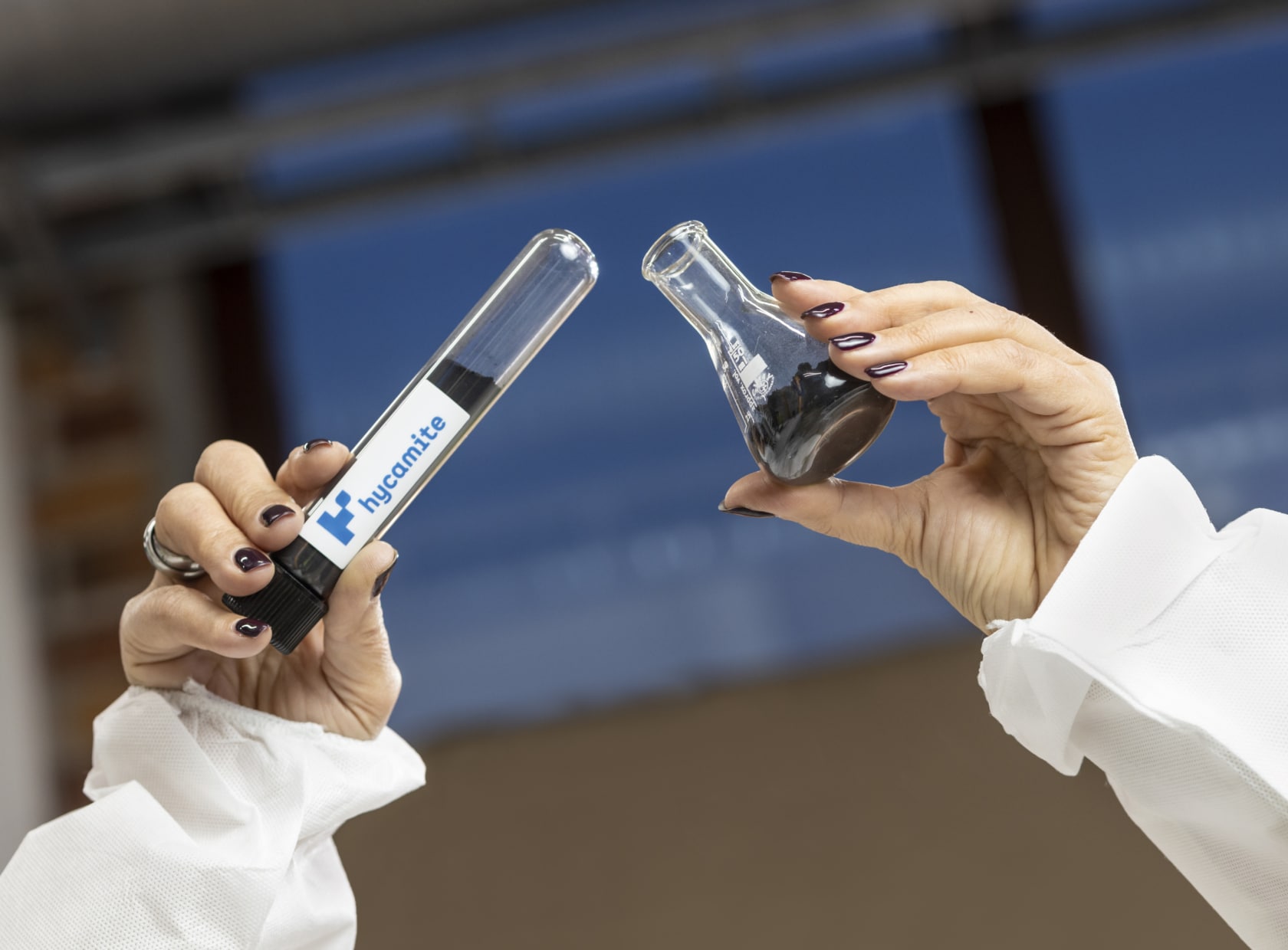 Hands holding test glass