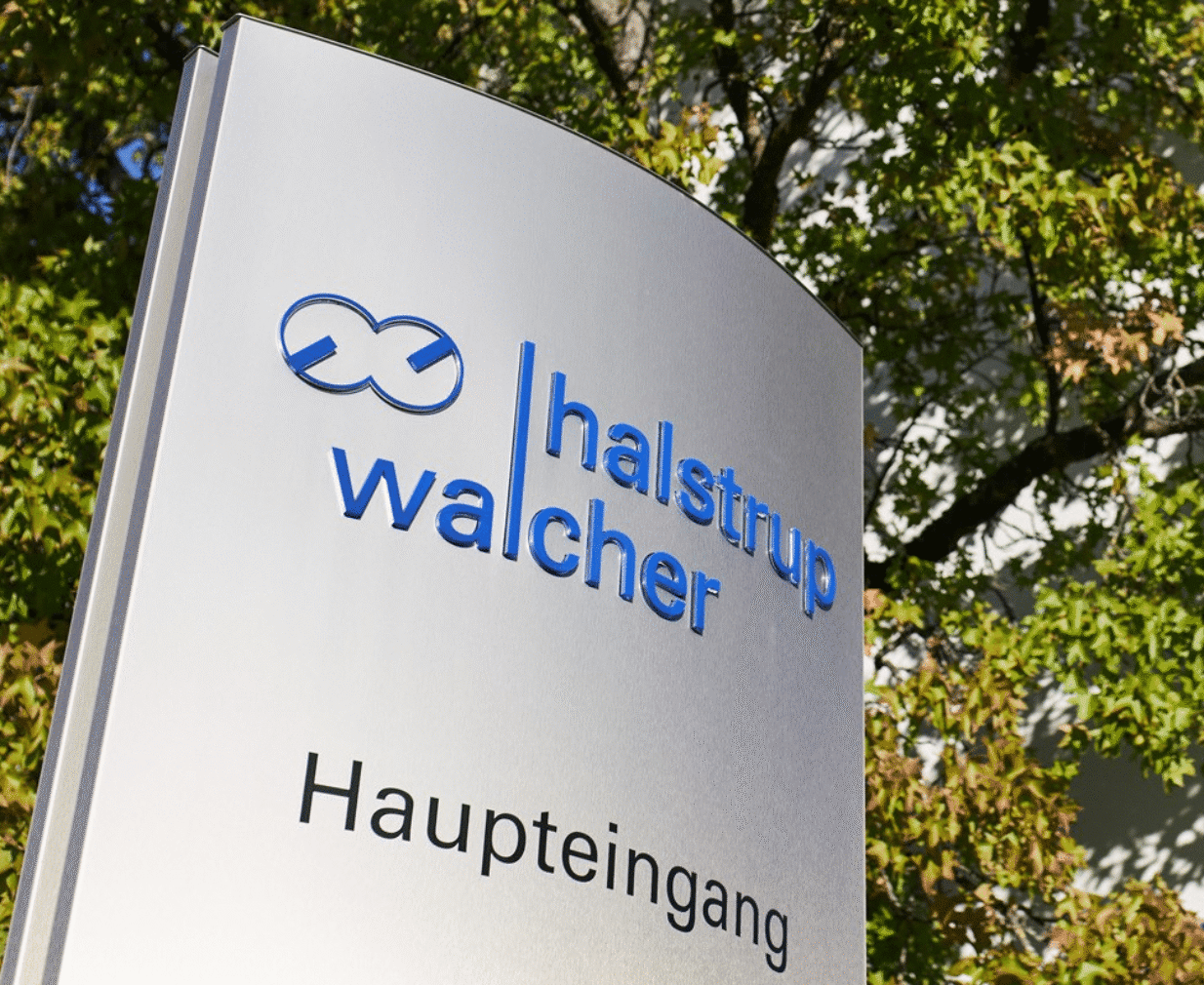 Halstrup Welcher logo sign
