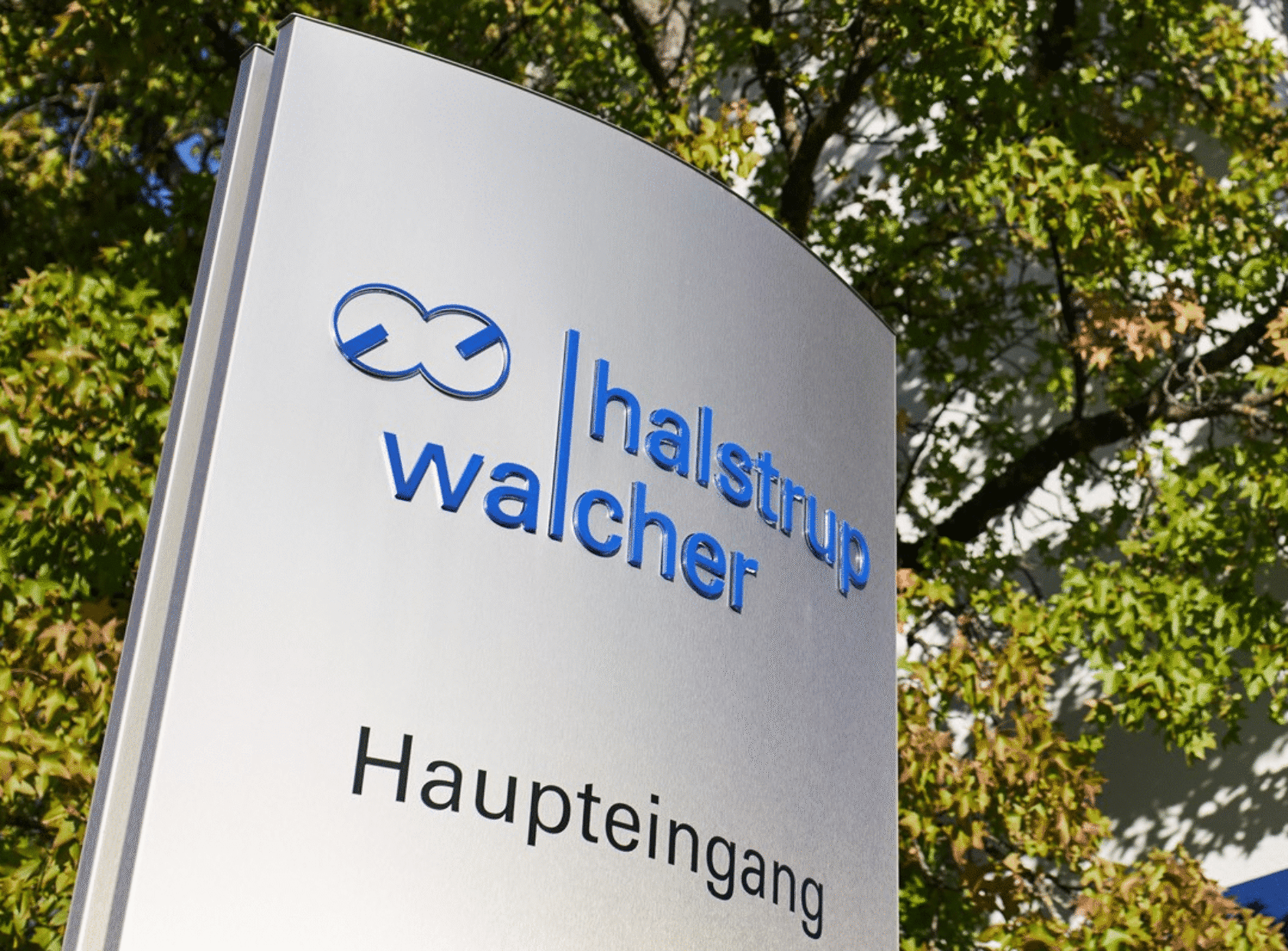 Halstrup Welcher logo sign